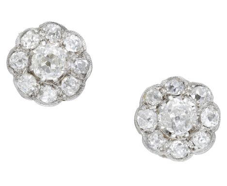 A pair of diamond earrings, each designed as a flowerhead cluster and set throughout with old brilliant and cushion-cut diamo