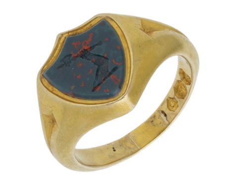 An 18ct gold hardstone signet ring, the shield-shaped bloodstone panel with crest engraving, to a bloomed gold mount with ree