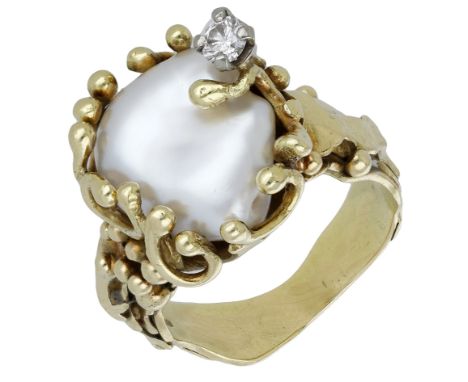A cultured pearl and diamond ring by Vivian Pare, 1985, the freshwater cultured pearl enveloped by scrolling tendrils and wit