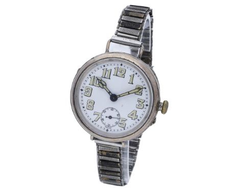 Swiss. A silver trench watch. circa 1914. Movement: manual winding, lever escapement. Dial: white enamel, Arabic numerals, su