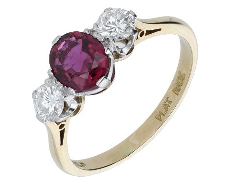 A ruby and diamond three stone ring, the oval mixed-cut ruby claw set between two brilliant-cut diamonds, stamped ‘18ct’ and 