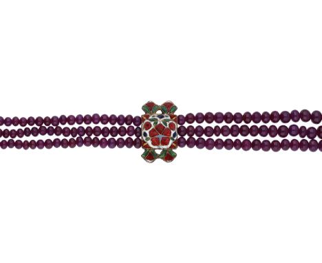 An Indian ruby bead necklace, the three-rows of graduated polished ruby beads, measuring approximately 3.2 - 5.4mm, with a Mu