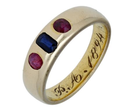 A sapphire and ruby ring, circa 1890, the gold tapered band bezel set with a rectangular-cut sapphire between two circular-cu