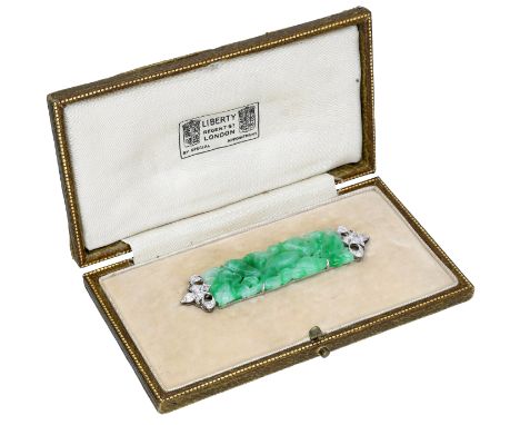 A mid 20th century jade and diamond brooch, retailed by Liberty, the pierced jadeite plaque carved to depict fruiting foliage