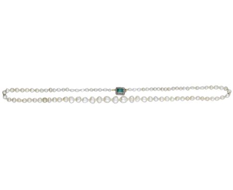 A natural pearl necklace with emerald and diamond set clasp, the graduated strand of pearls terminating in step-cut emerald a