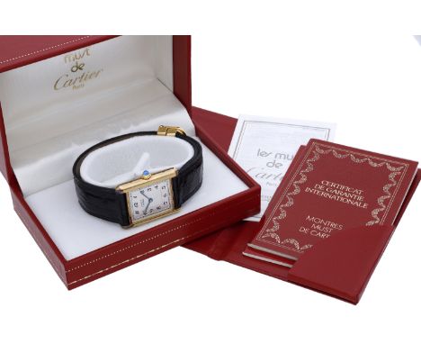 Must de Cartier. A lady’s gold plated rectangular wristwatch, Tank, circa 1990. Movement: quartz. Dial: silvered, Arabic nume