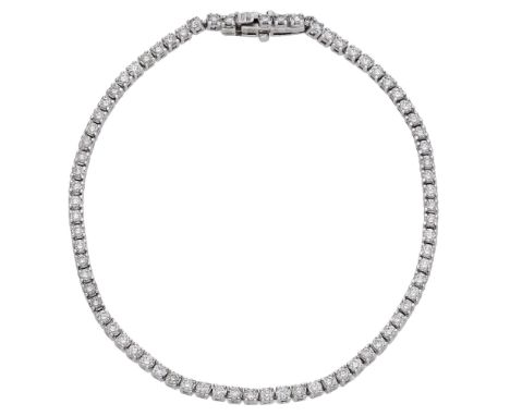 A diamond line bracelet, the articulated bracelet claw-set throughout with brilliant-cut diamonds, stamped ‘750’, total diamo