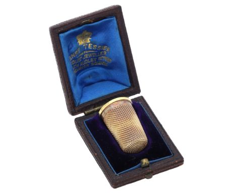 A 19th century gold thimble,  of traditional design, fitted case by Henry Tessier, length 22mm. £100-£150  ---  Condition Rep