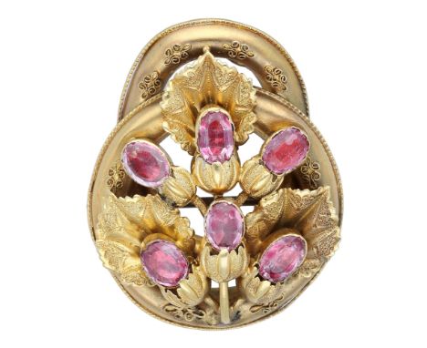 A mid 19th century gem-set brooch, the gold knot with bead and wirework decoration, applied with gold leaves and oval-cut gem
