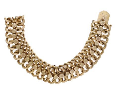 A French 18ct gold bracelet, the fancy-link bracelet with sandblast roundel decoration, the clasp bearing French eagle head a