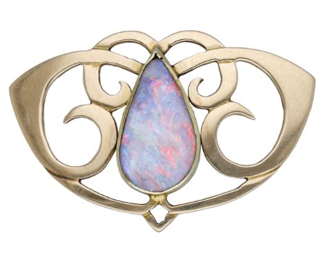 An early 20th century Art Nouveau opal doublet brooch, of whiplash scroll design and centred with a pear-shaped opal doublet,