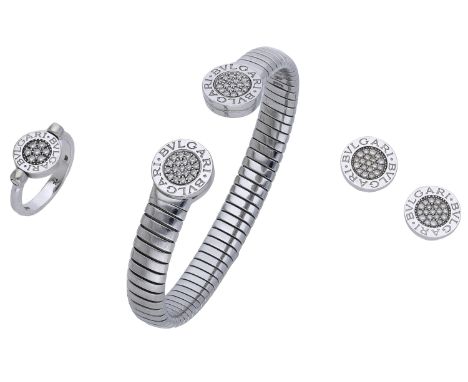 A tubogas suite by Bulgari, comprising a stainless steel and diamond sprung torque bangle, an 18ct white gold and diamond swi