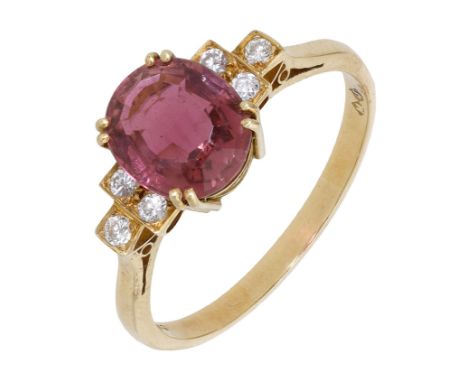 An 18ct gold pink tourmaline and diamond ring, the oval mixed-cut tourmaline claw-set between trios of brilliant-cut diamonds