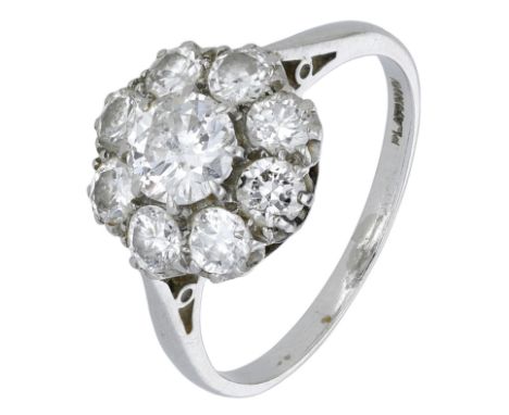 A diamond cluster ring, set throughout with old-cut and transitional-cut diamonds, stamped ‘PLATINUM’, total diamond weight a