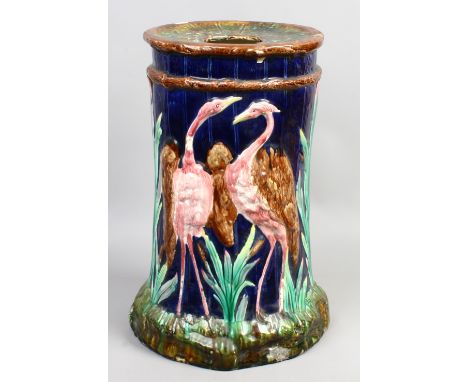 A Victorian Majolica garden seat moulded in relief with herons.