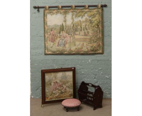 A fire screen, foot stool, wall tapestry and magazine rack.
