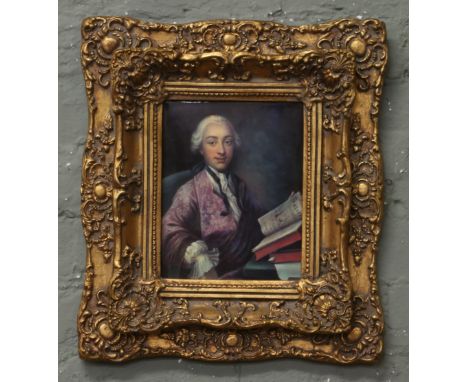 A gilt framed portrait plaque of a gentleman in 18th century dress.
