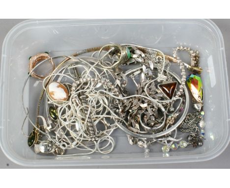 A box of mixed silver jewellery including snake linked chains, Chinese jade ring, amber, mystic quartz pendant and tennis bra