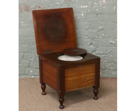 A Victorian mahogany commode with liner.