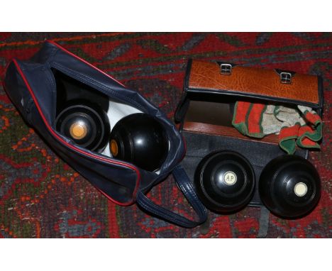 Two cased sets of bowling balls by Thomas Taylor and R. G, Lawrie both of Glasgow.