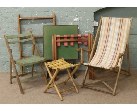 A collection of folding furniture to include deck chair, card table, clothes horse etc.