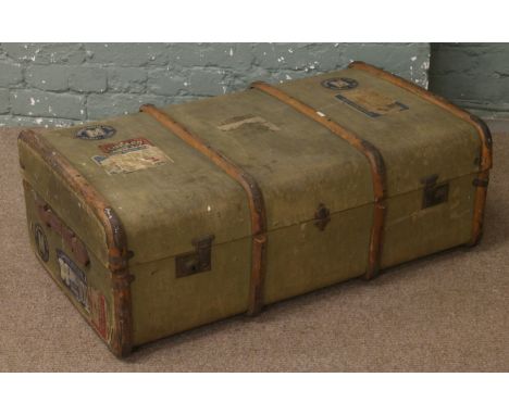 A vintage canvas and timber bound travelling trunk and contemporary Cunard labels.