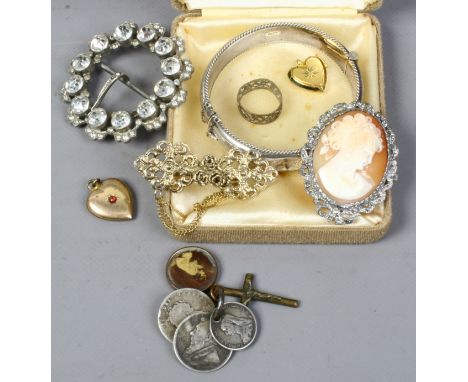 A small mixed lot of costume jewellery including a white paste buckle, cameo brooch and a silver bangle.