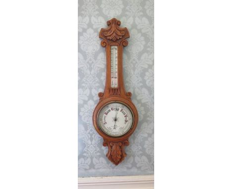 A Victorian barometer/thermometer in foliate scrolling oak frame, by M.Elam, Northwich, Middlewich and Winsford, 90cm high