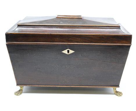 A Regency mahogany tea caddy, stamped Gillows, Lancaster, fitted interior with a central mixing bowl flanked by twin lidded c