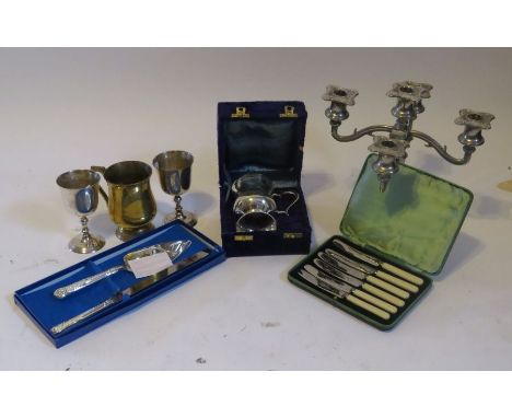 A cased cake slice, a cased flatware, 4 goblets and five branch candle sticks all plated.These lots have been donated by Rota