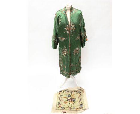 An early 20th century Chinese coat or robe made from green silk with hand embroidery. This shows signs of wear and has some s
