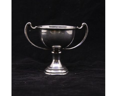 A hallmarked silver two-handled trophy on pedestal foot, Birmingham, early twentieth century. 8 cm tall. 75g