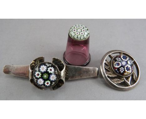 A Caithness Paul Ysat millerfiori hall marked silver brooch together with a similar broch converted from a ring and a ruby gl