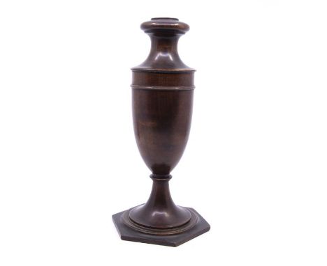 A 19th century mahogany candlestick, in urn form on a stepped pentagon base (cracked and repaired to base 28cm tall&nbsp;