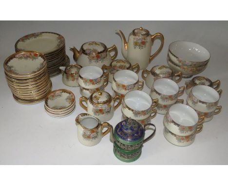 A mid 20th century Japanese tea set and an oriental base metal teapot with dragon designThese lots have been donated by Rotar