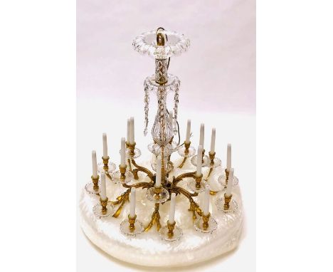 An exceptional French ormolu and cut glass eighteen-light chandelier by Baccarat, Paris, early 20th century. The central balu