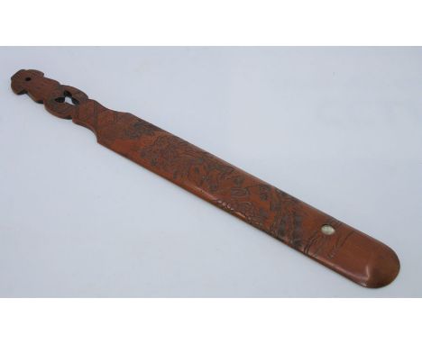 A 20th century Japanese carved bamboo page turner depicting a man in natural surroundings, featuring&nbsp; inlaid mother of p