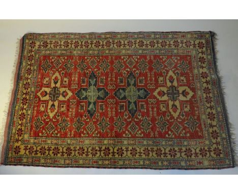 A fine Afghan Kazak rug 5' x 3' approx. 100% wool pile and a vintage wall mirror These lots have been donated by Rotary Distr