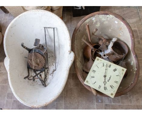 Two vintage metal hip baths and its assorted contents, to include a longcase clock face, a cooking pot etc