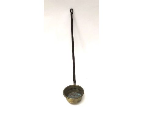 A 19th century large French brass ladle 74cm in length&nbsp;
