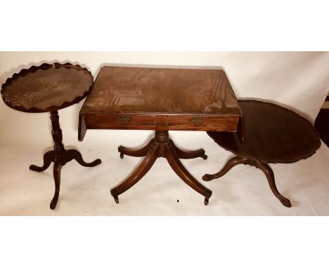 A George III mahogany sofa table; a similar wine table; a 19th century foliage shape low table (3)