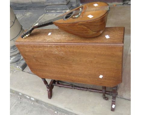 An early 20th century sutherland table and a mandalinThese lots have been donated by Rotary District 1210, Alumni Association
