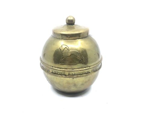 A George V brass souvenir Tea caddy by Lipton's, of baluster form stamped British Empire Exhibition 1924 and Lipton's Souveni