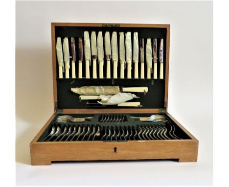 An silver eight person cased canteen of flatware comprising:- eight silver salad forks, eight faux bone handled stainless ste