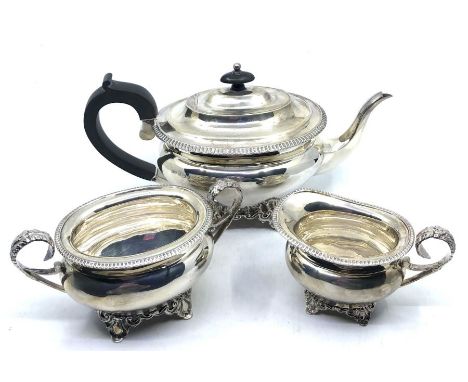 An Edwardian Silver tea set comprising:- a teapot, sugar bowl and a milk jug, with gadrooned edge, the milk jug and sugar bow