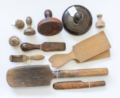Dairy bygones including a pair of beech butter beaters, a single example, a yew wood butter knife, a semi-circular butter cur