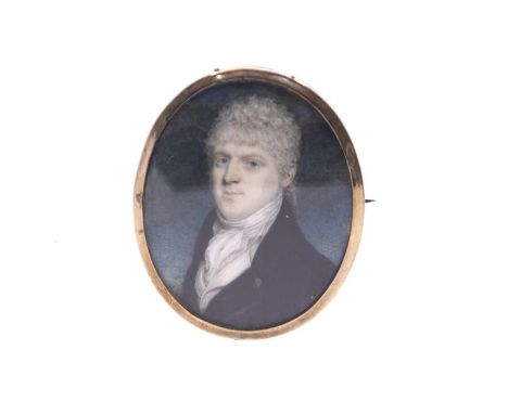 An early 19th century portrait miniature in a rose gold oval frame, with blue enamel verso 6.5cm H
