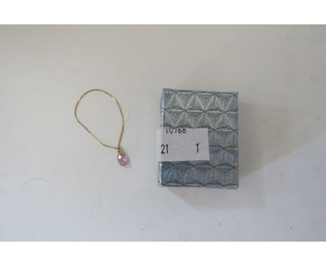 A marked yellow metal droplet with pink stoneThese lots have been donated by Rotary District 1210, Alumni Association support