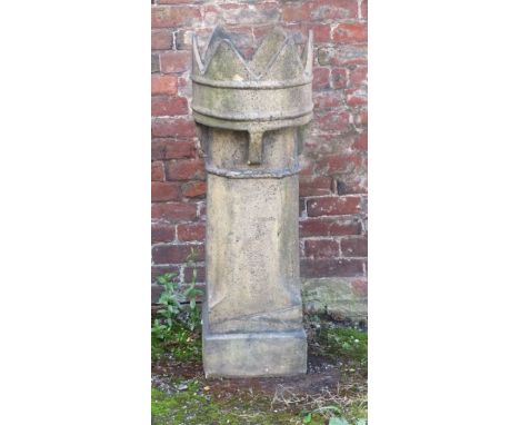 An architectural chimney pot with crown finial