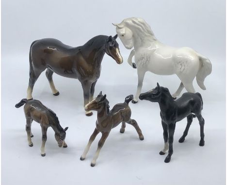 A collection of ceramic horses comprising:- mostly Beswick examples, the Stallion with a broken tail by Kaiser of Germany no.